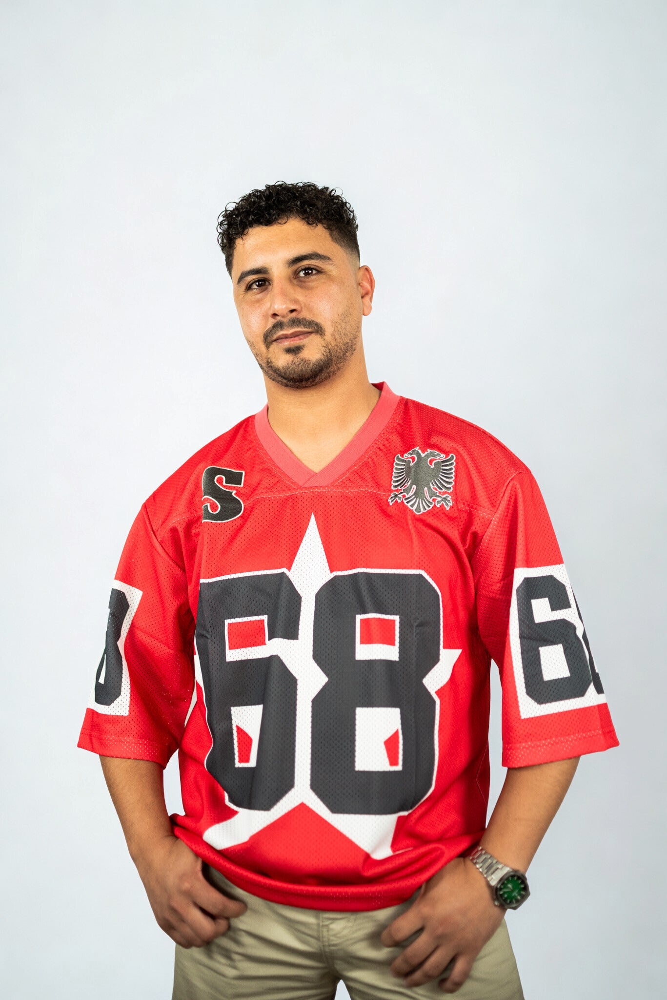 Bold red mesh sports jersey by SIDE EFFECT featuring number 68 and eagle crest, oversized statement streetwear piece
