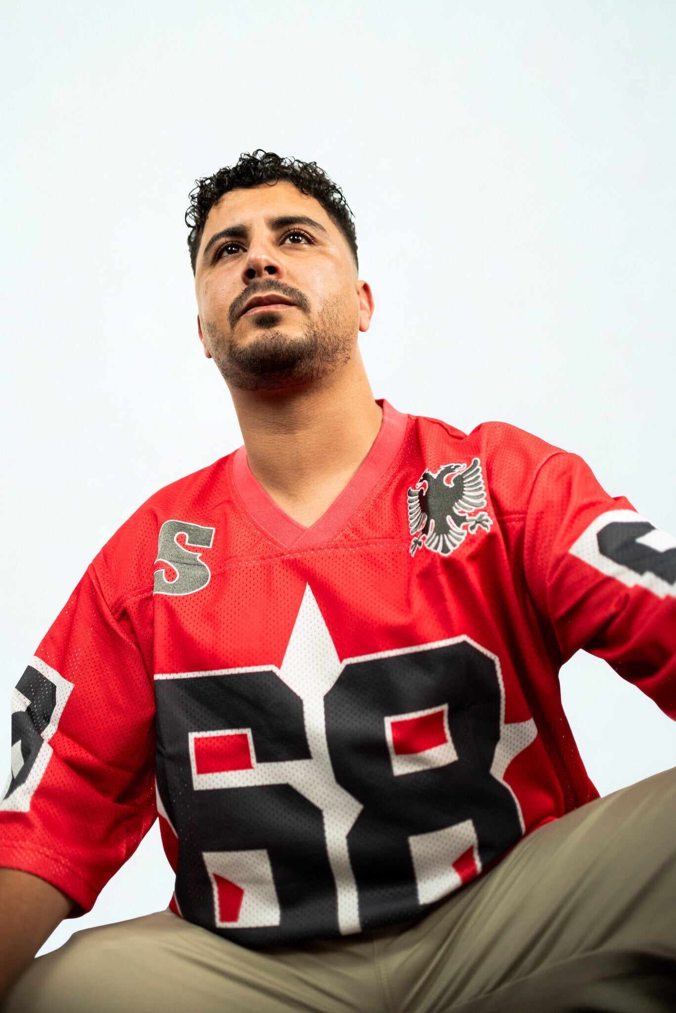 SIDE EFFECT oversized red jersey with black and white sports numbers, urban fashion for rebellion and movement lovers