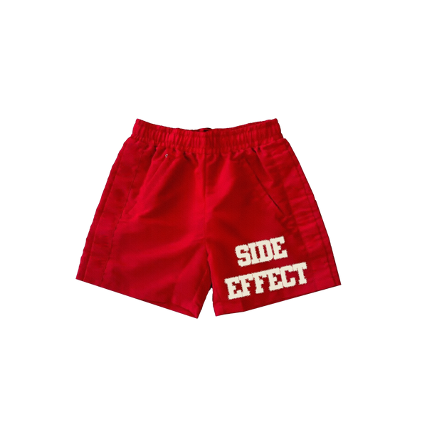 SIDE EFFECT Distressed Logo Shorts – Red